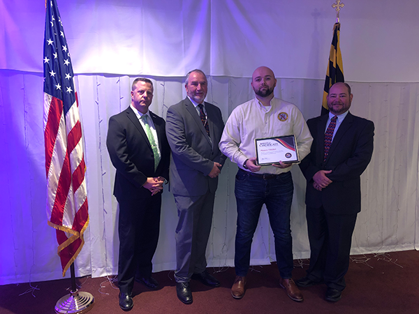 (L - R) MATP Director MacLarion, Deputy Secretary McGlone, Award winner in the “Mentor” category, Mason Holden, Instructor with the UA Local 5 Washington DC Joint Plumbing Apprenticeship Committee, and MATC Chair Cavey.