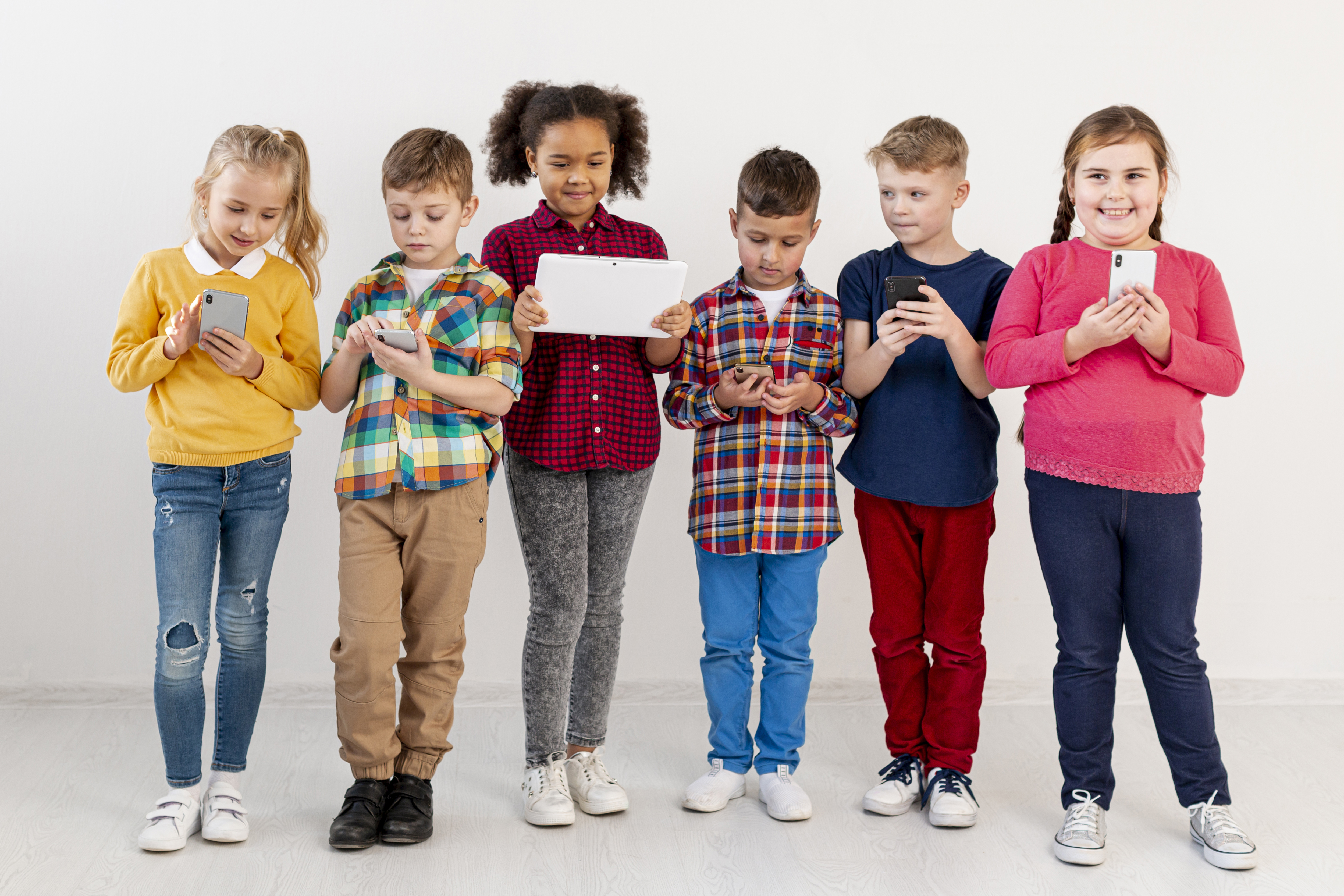 young childrens with different devices